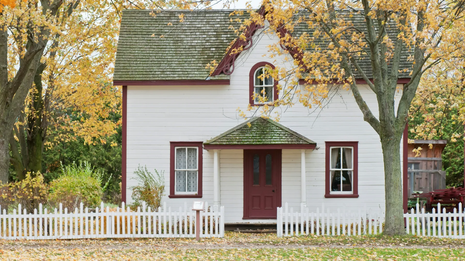 a white house with a red door