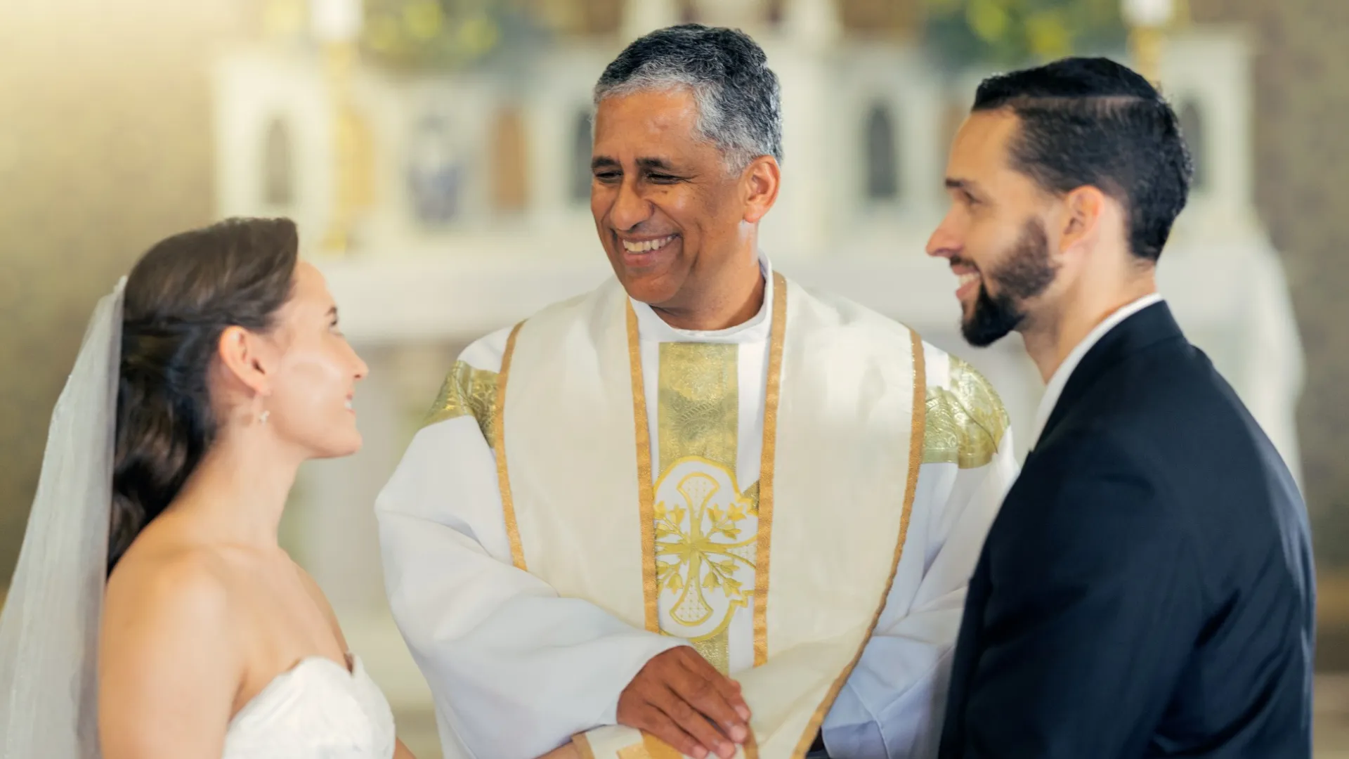 Atul Kapoor in a white robe and a woman in a white dress