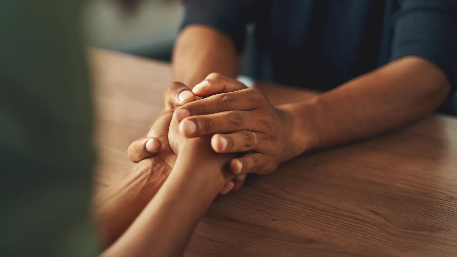 a close-up of hands shaking