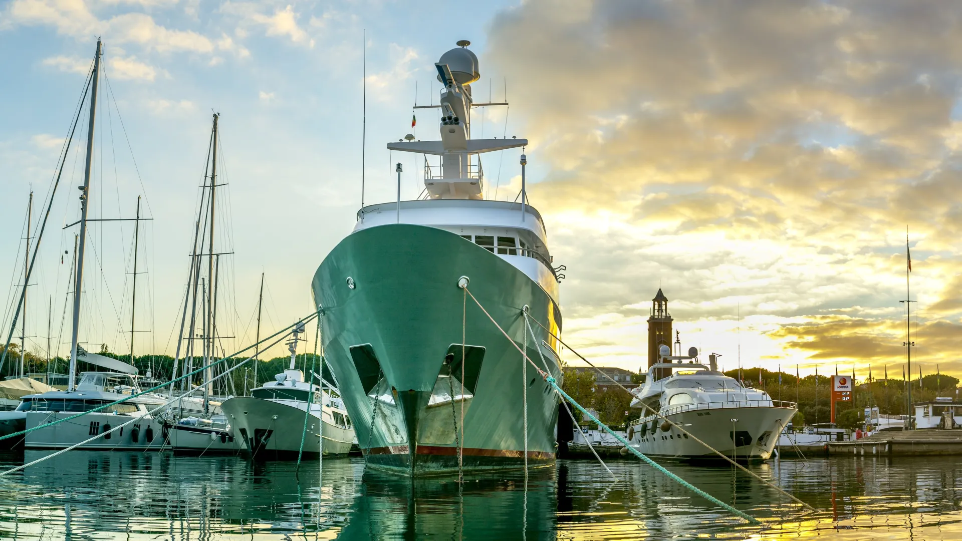 a group of boats sit in a harbor