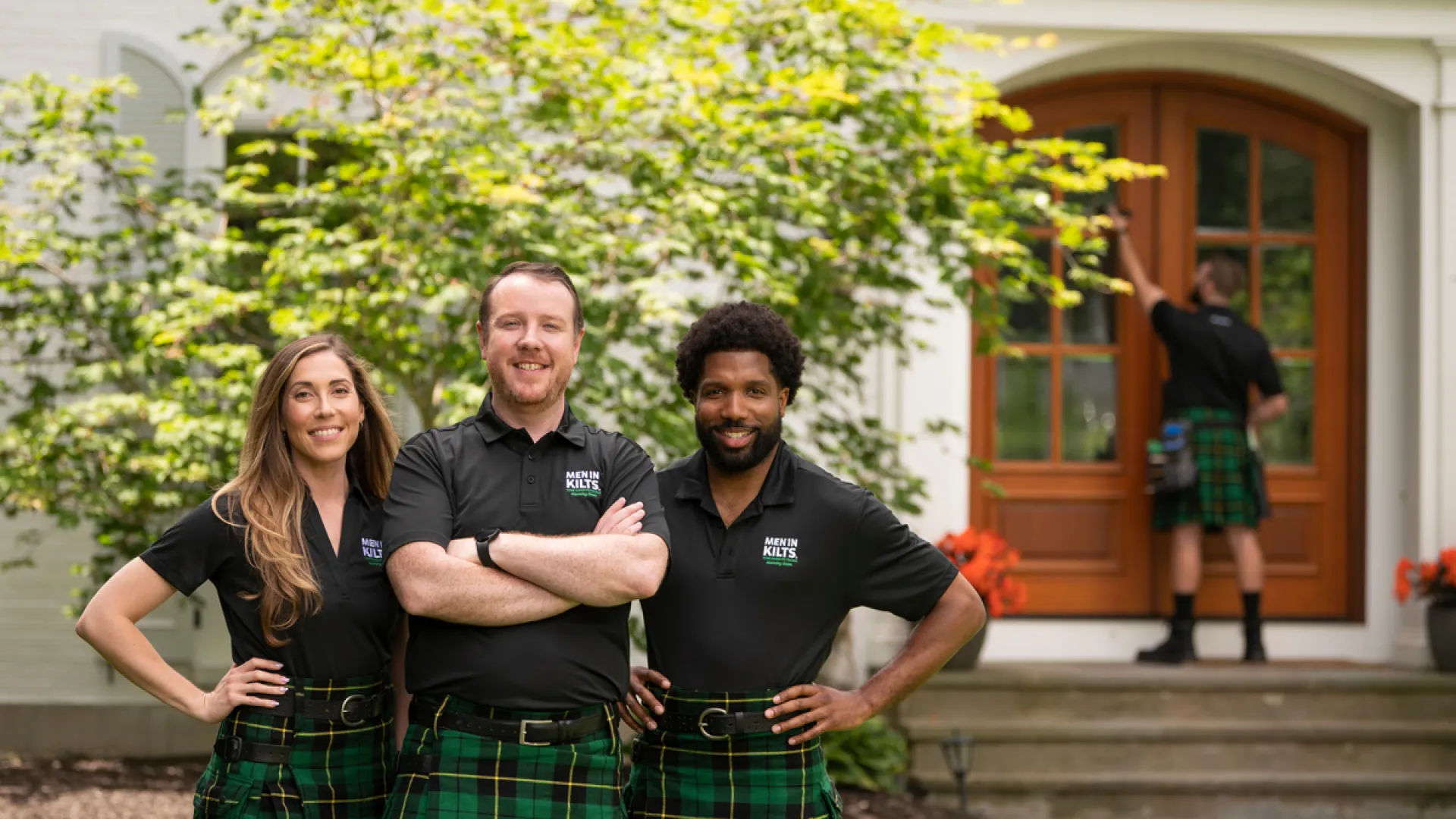 Men In Kilts Owner and Team in front of a customer's home