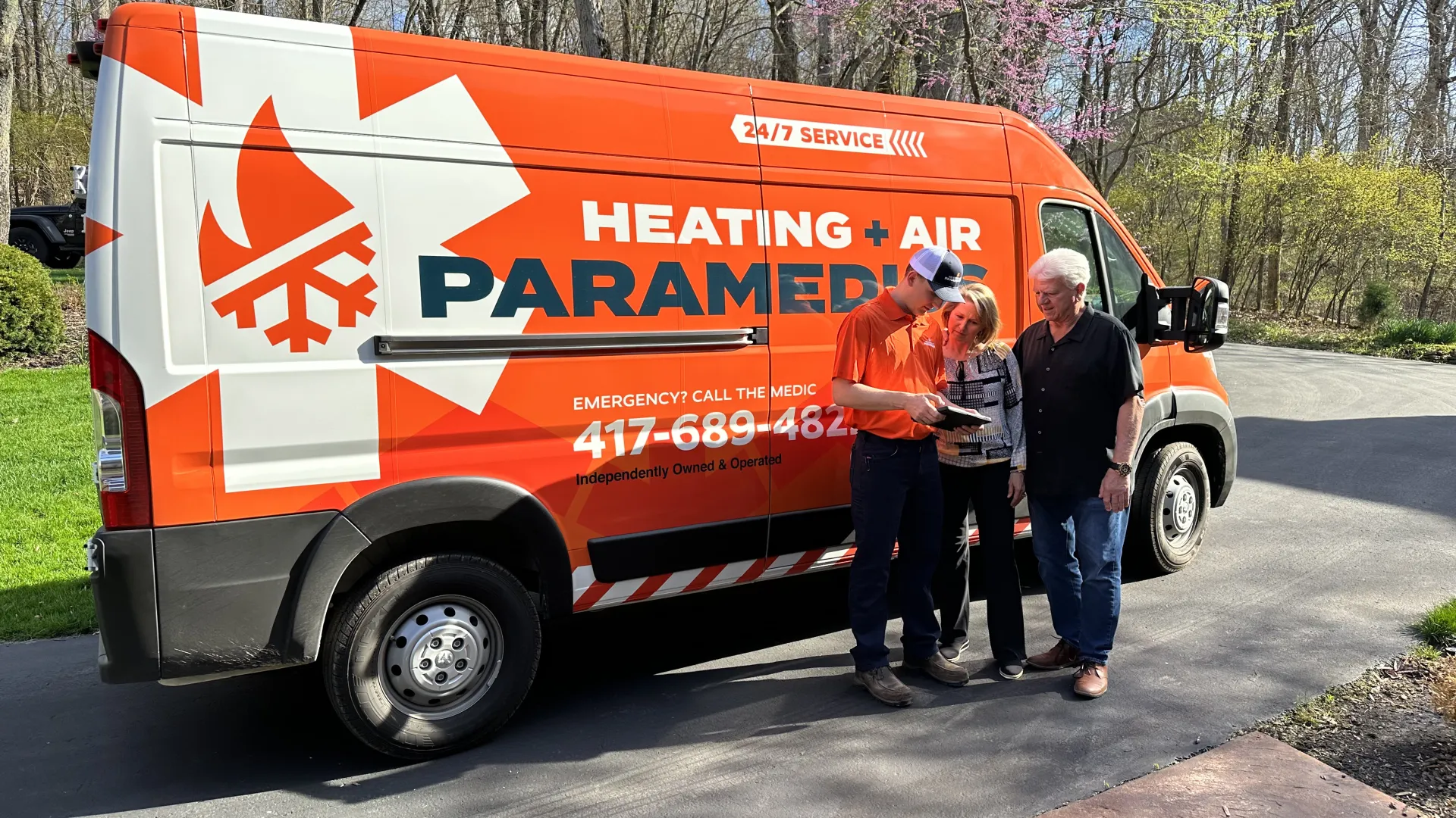 a group of people standing next to a van