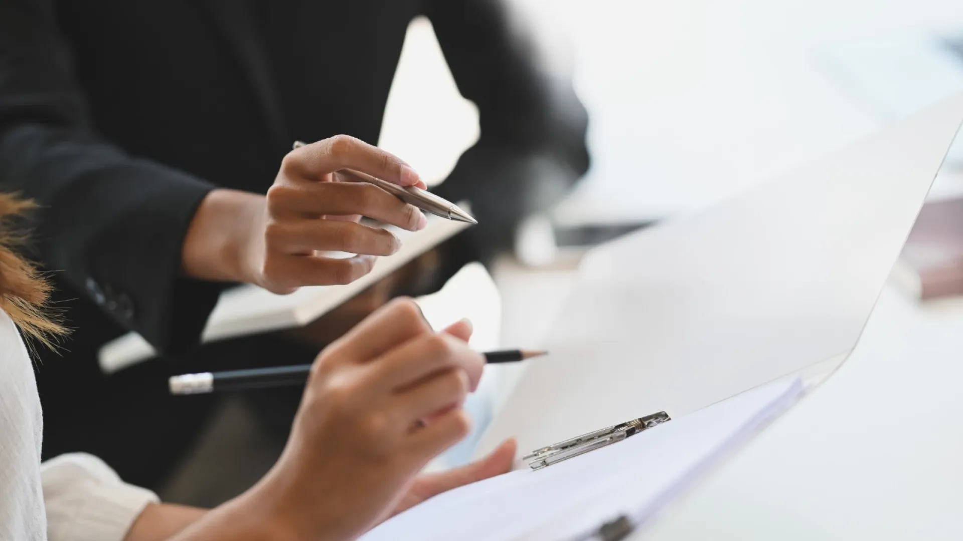 a person holding a pen