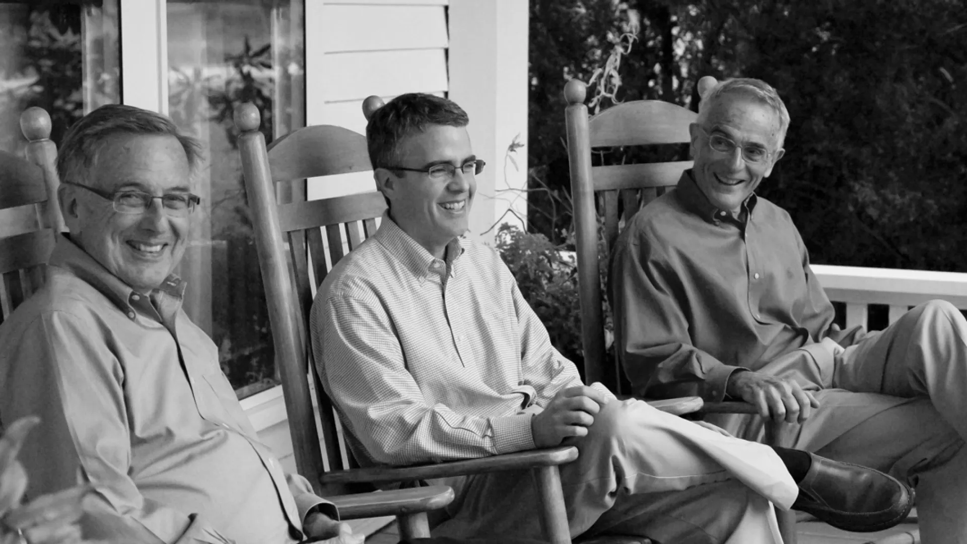 a group of people sitting posing for the camera