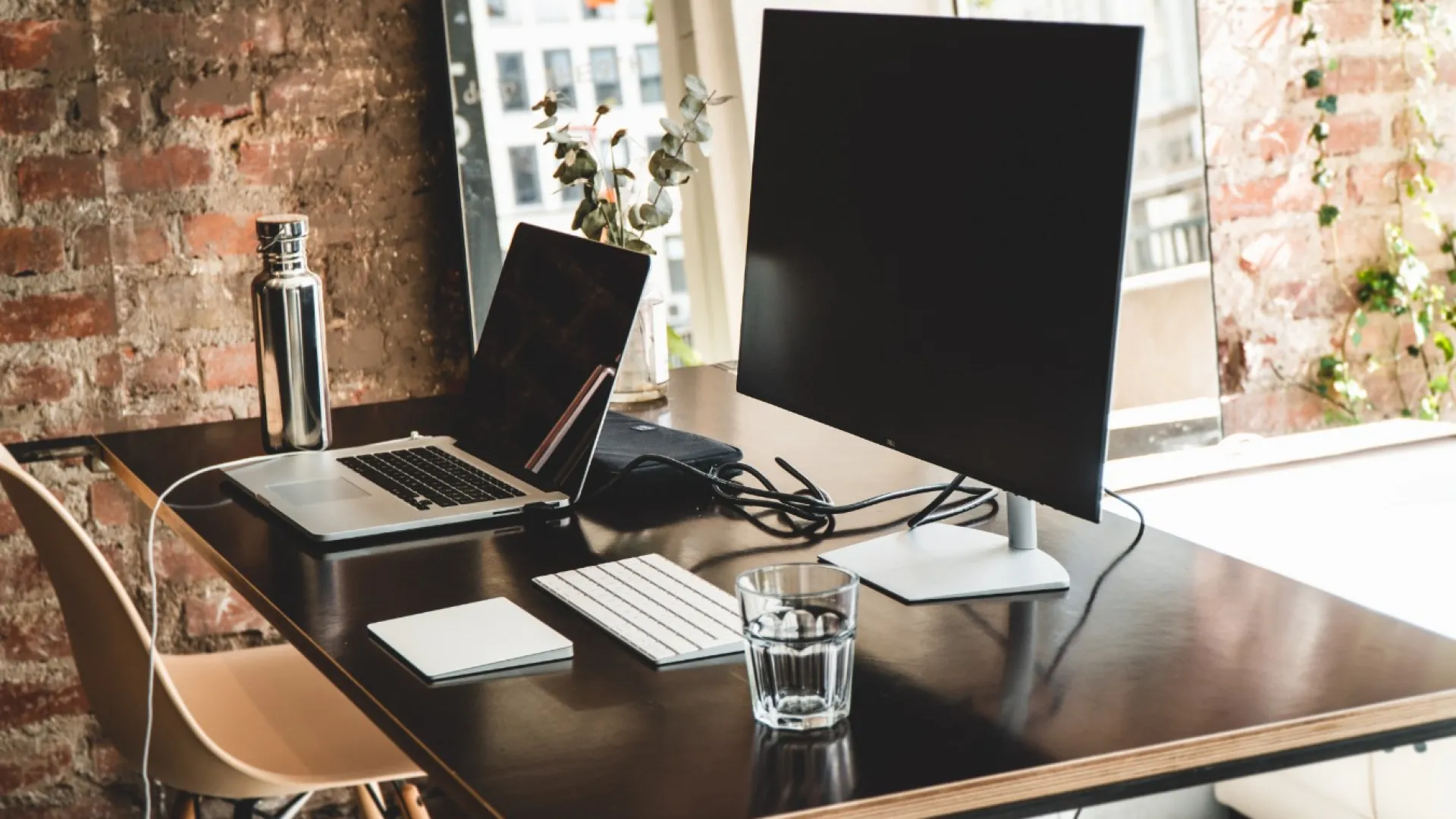 a laptop computer sitting on top of a table