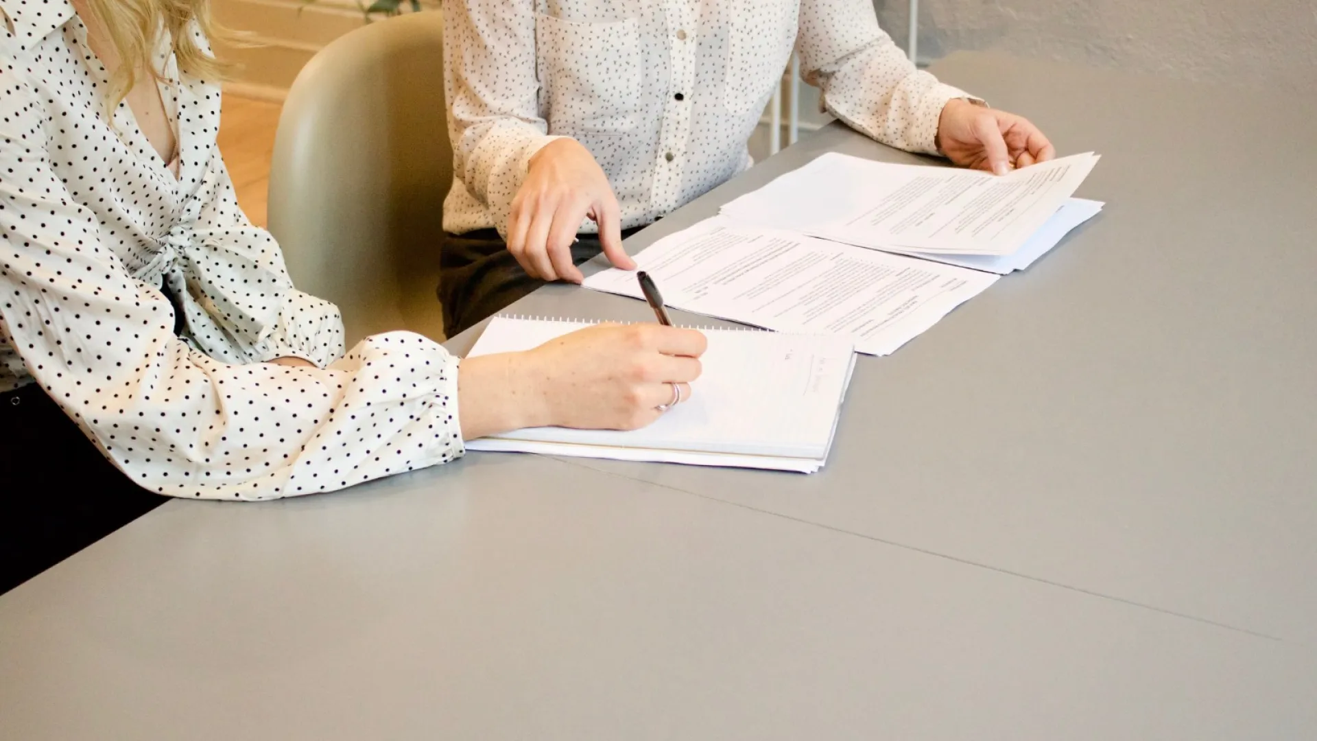 a woman sitting at a table