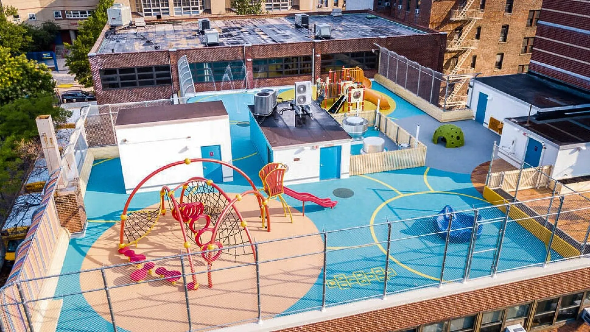 a building with a pool and a deck with a slide