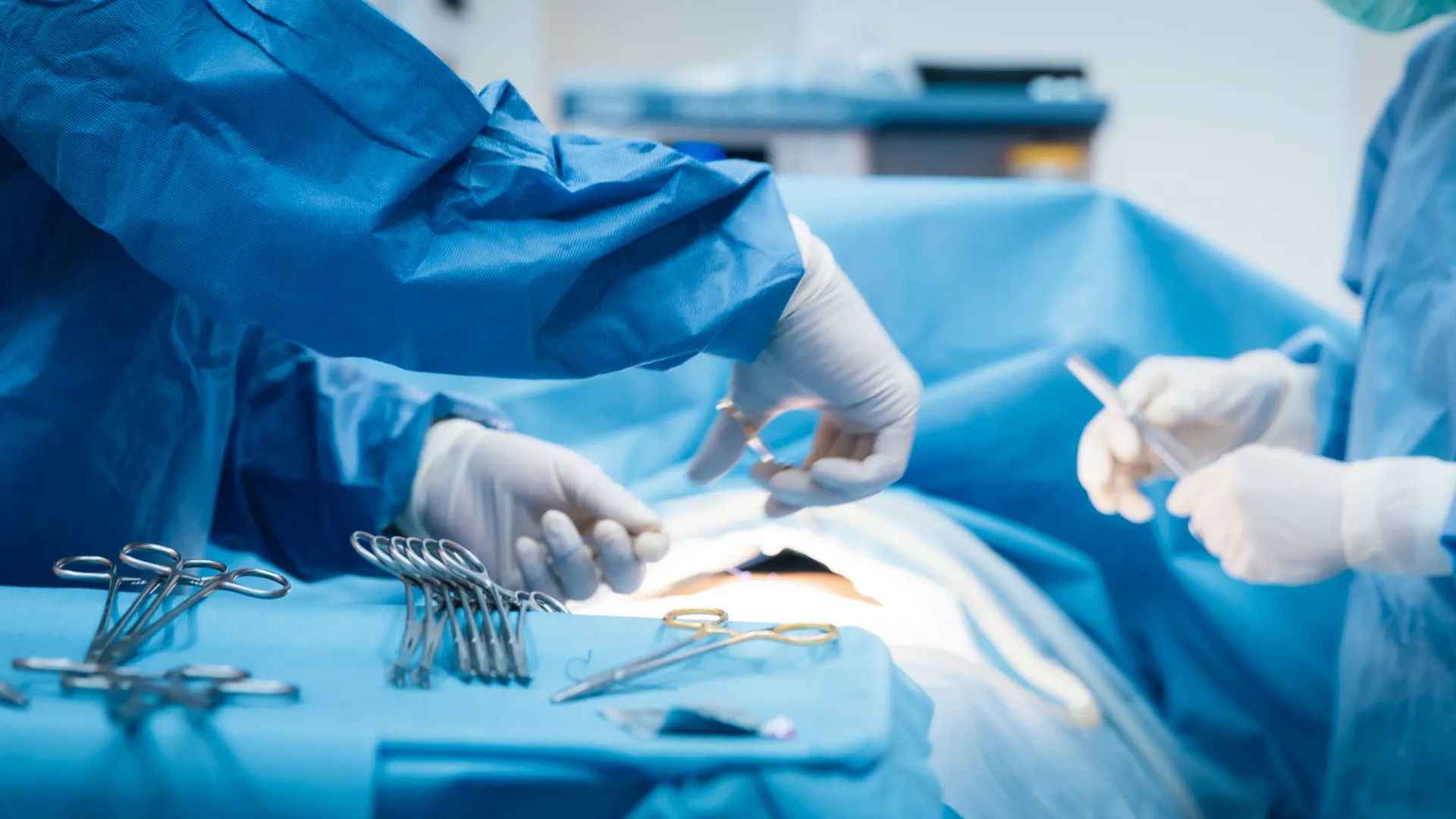 a close-up of surgeon hands in OR