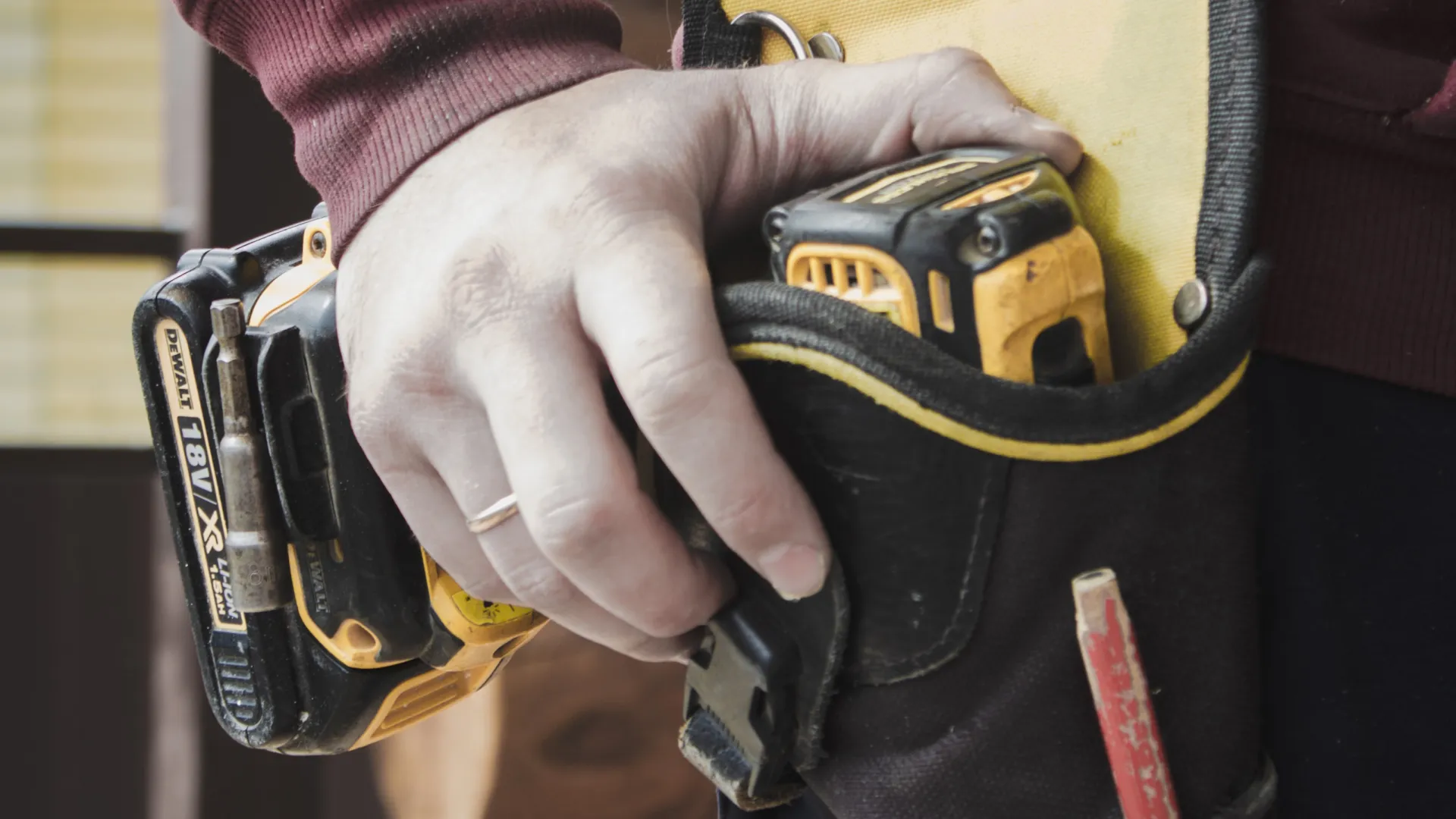 a person holding a drill