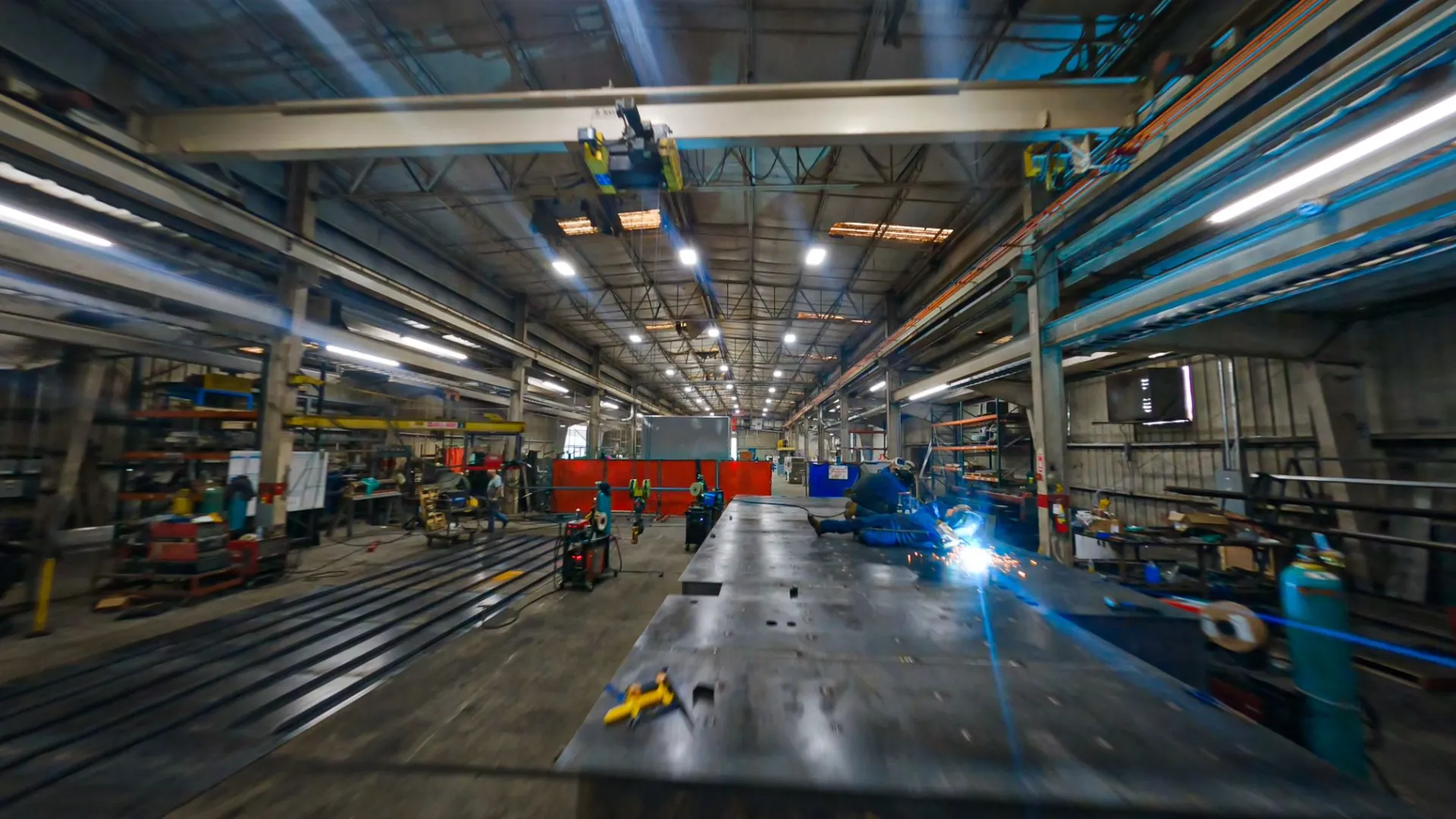 a warehouse with a few people