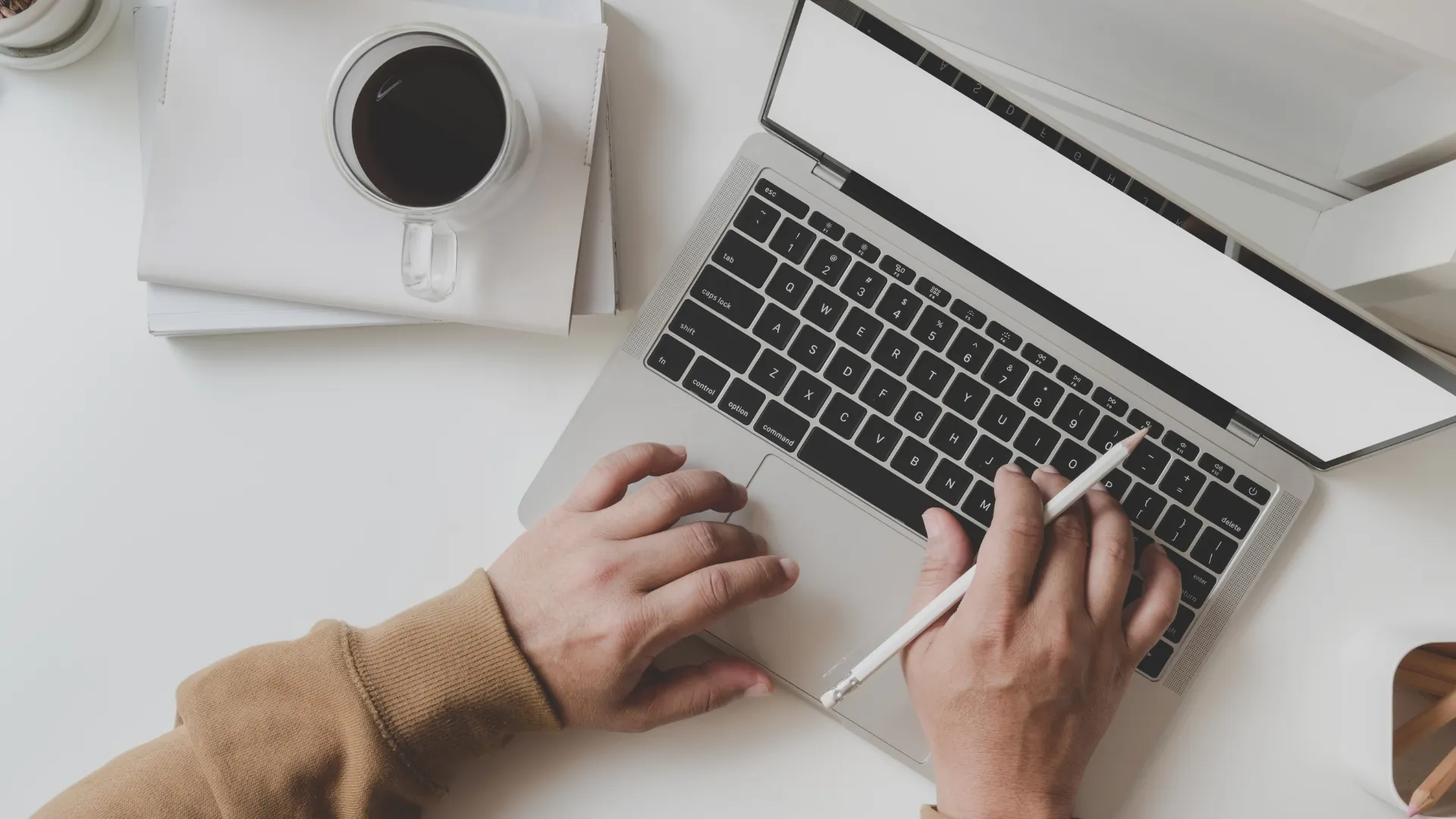 a person typing on a laptop