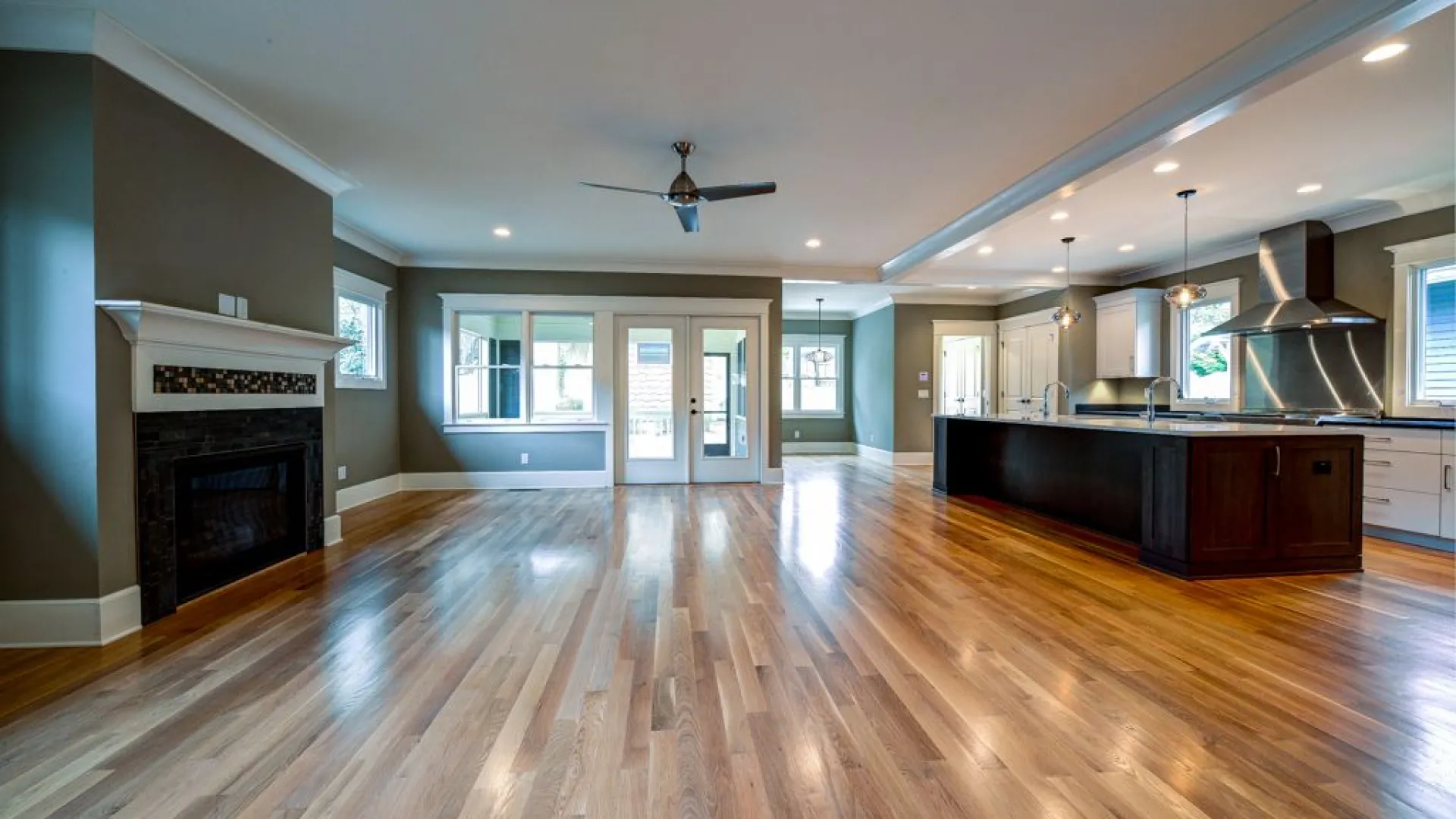 a large room with a wood floor and a wood floor