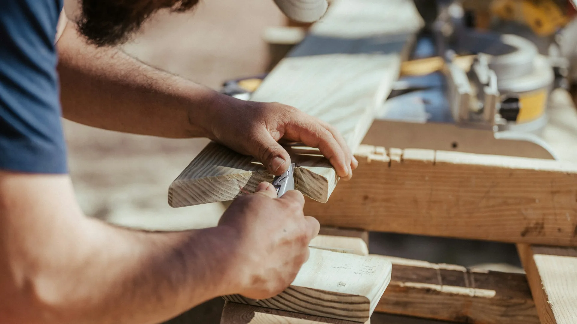 a man cutting wood