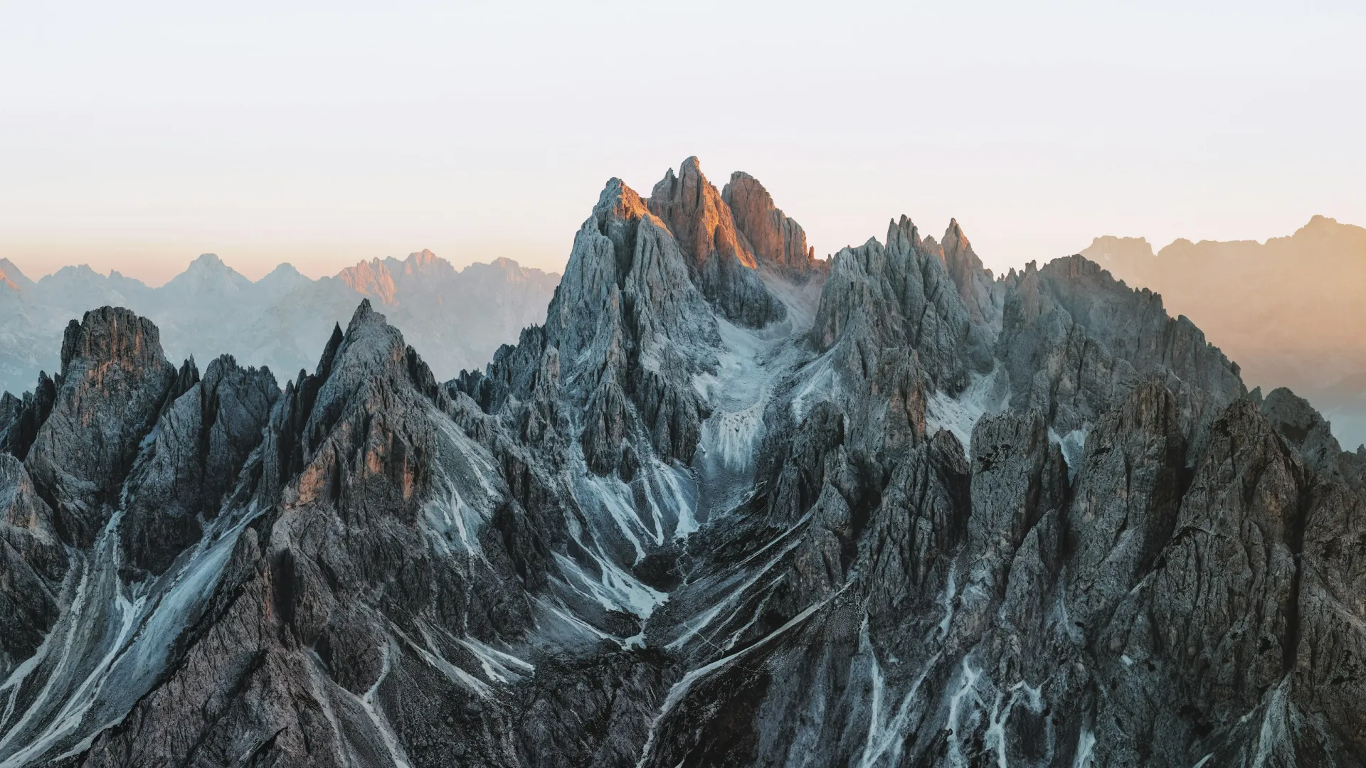 a rocky mountain with snow