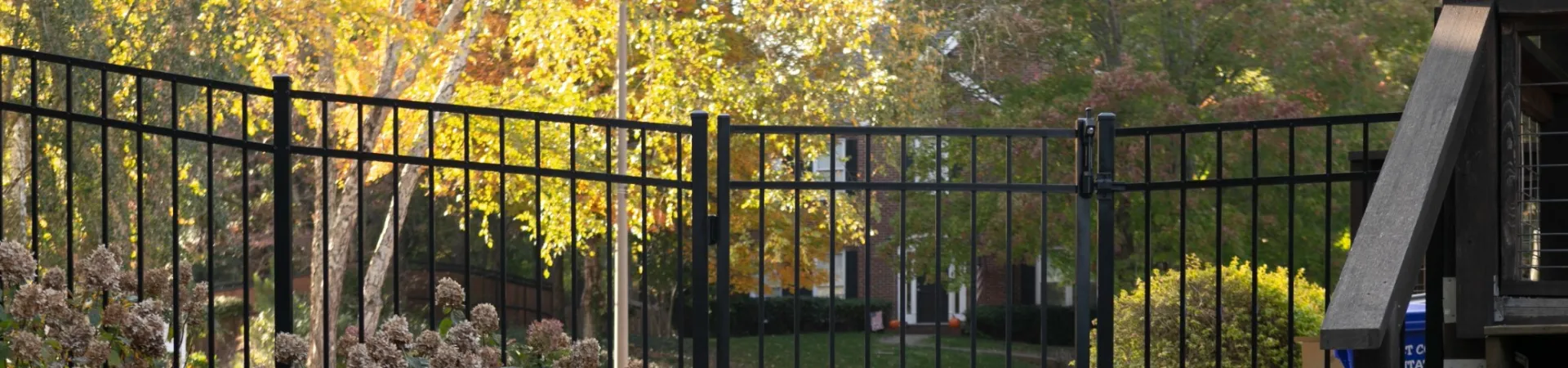 a black gate with a metal fence