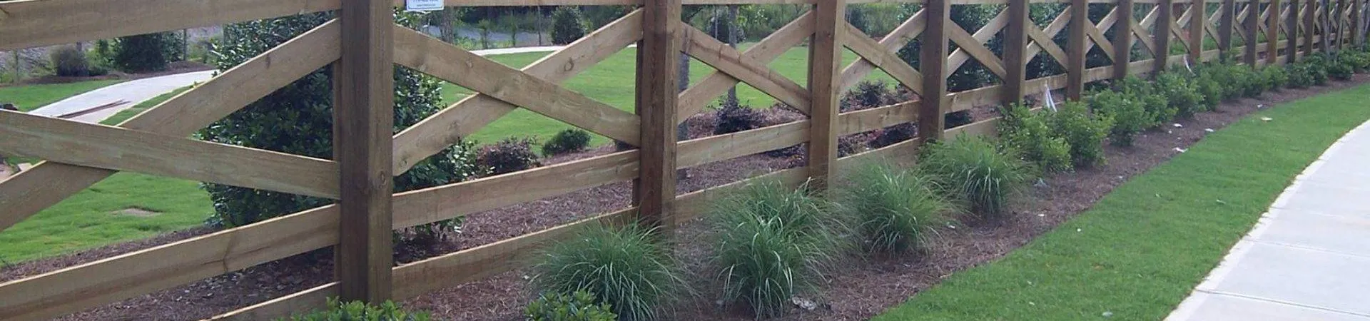 a wooden fence in a garden