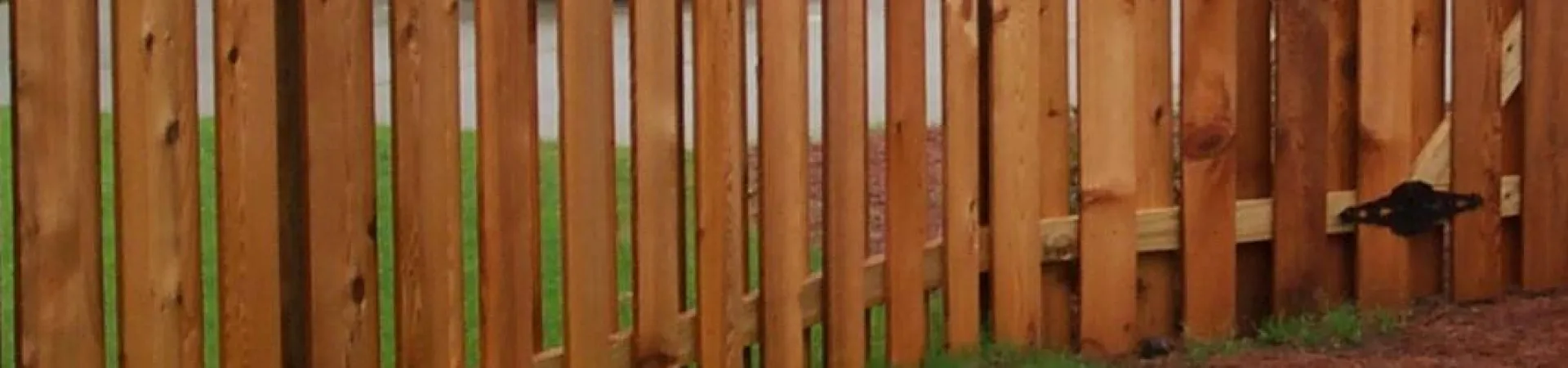 a fence with a bird on it