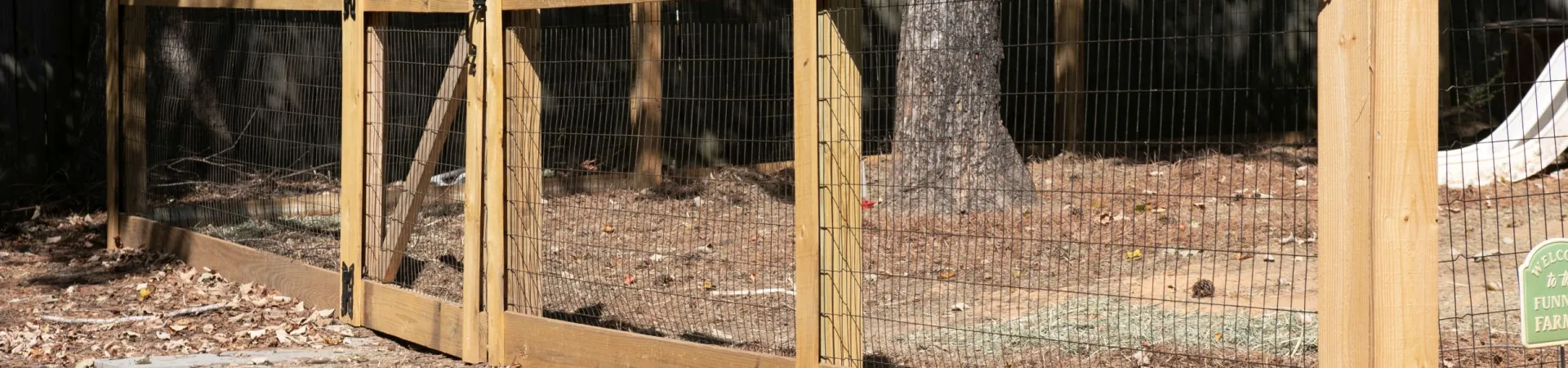 a wooden fence in a yard