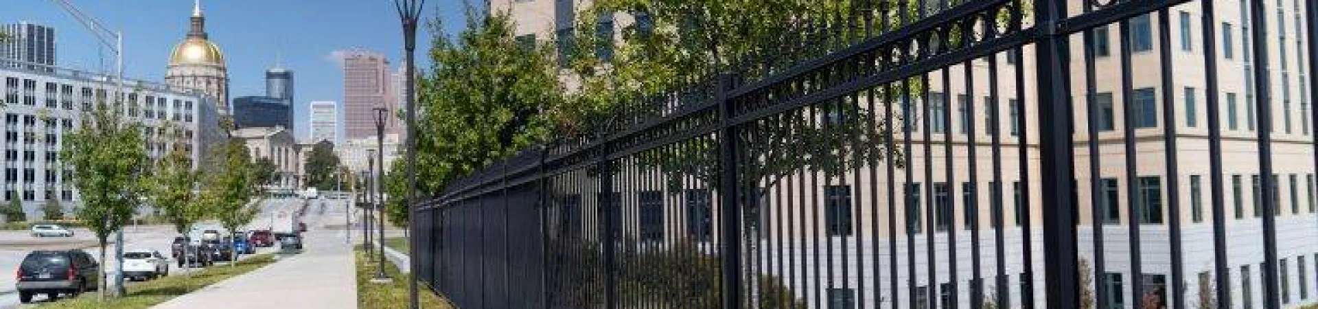 a black gate in front of a building