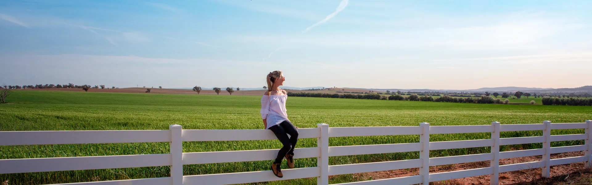 a person jumping over a fence