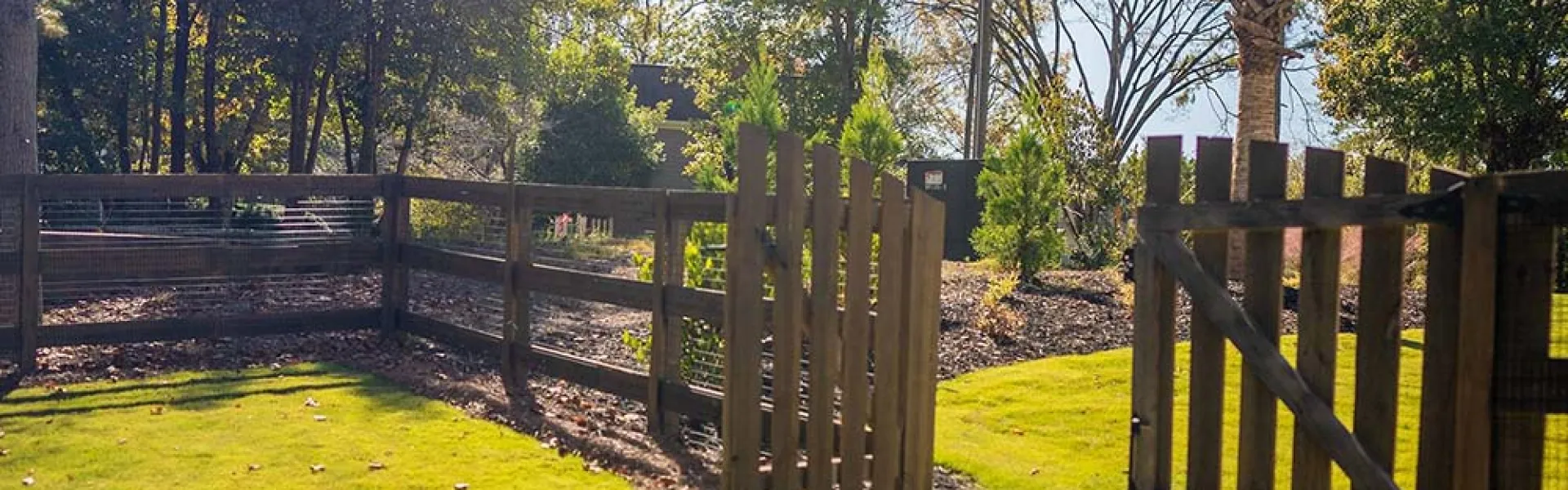 a wooden fence in a yard