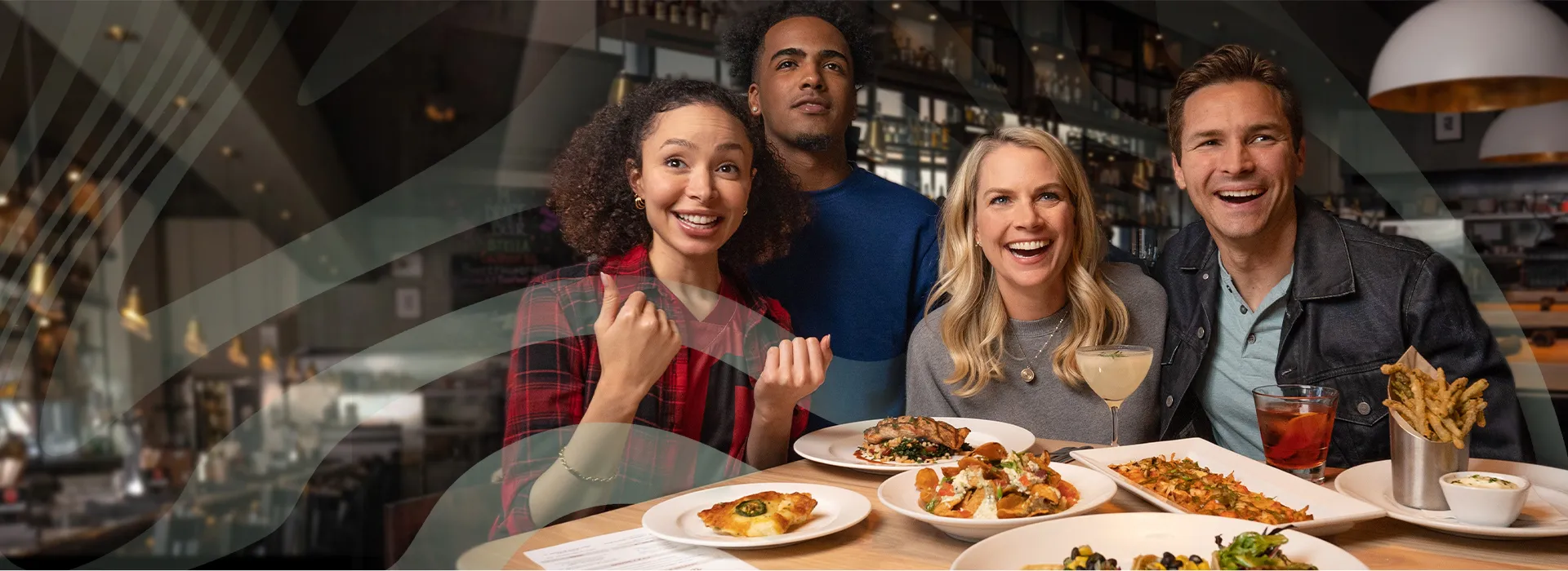 Rocky Myers, Erin Ross et al. sitting at a table with food