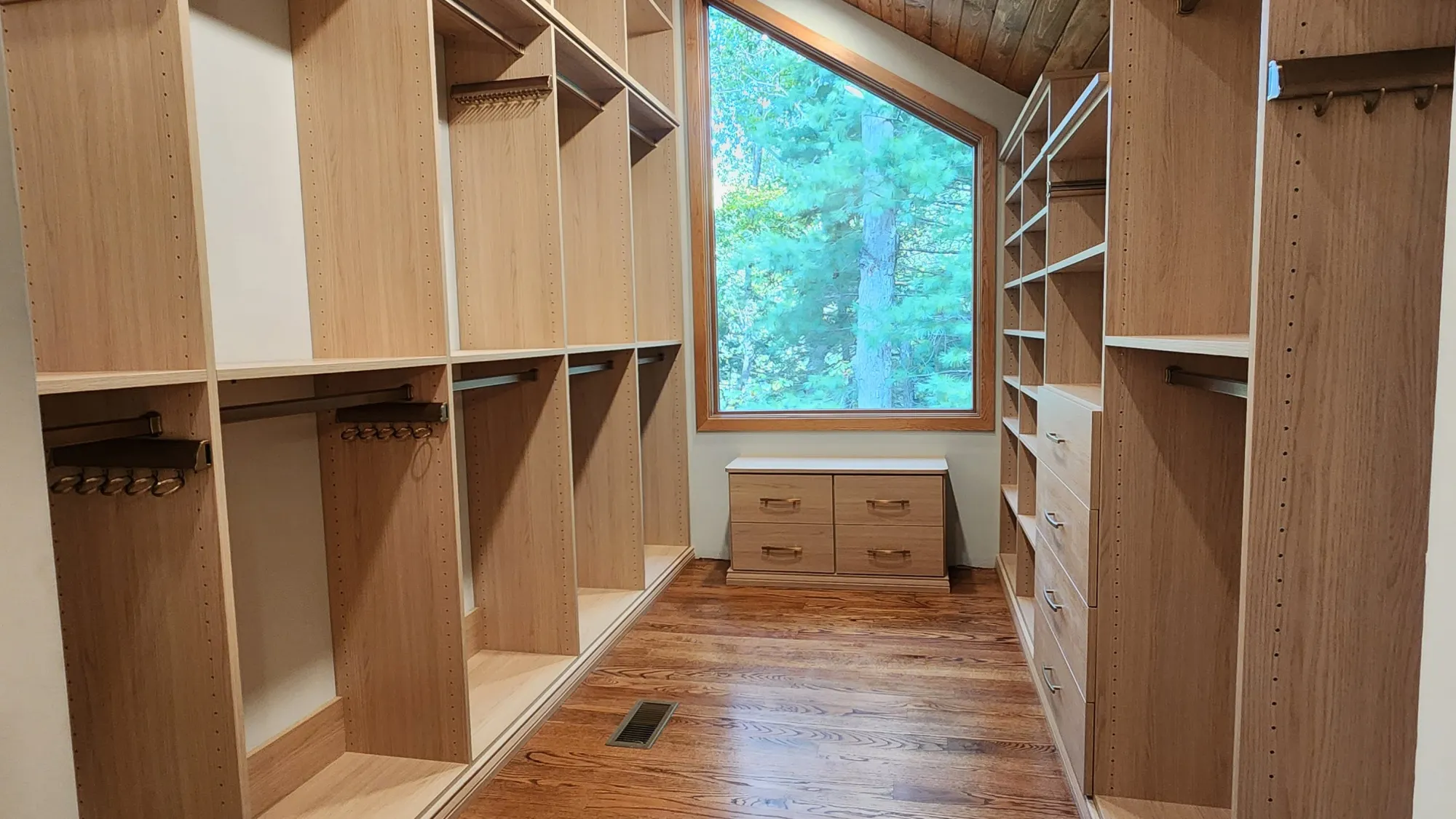 a room with a wood floor and a window