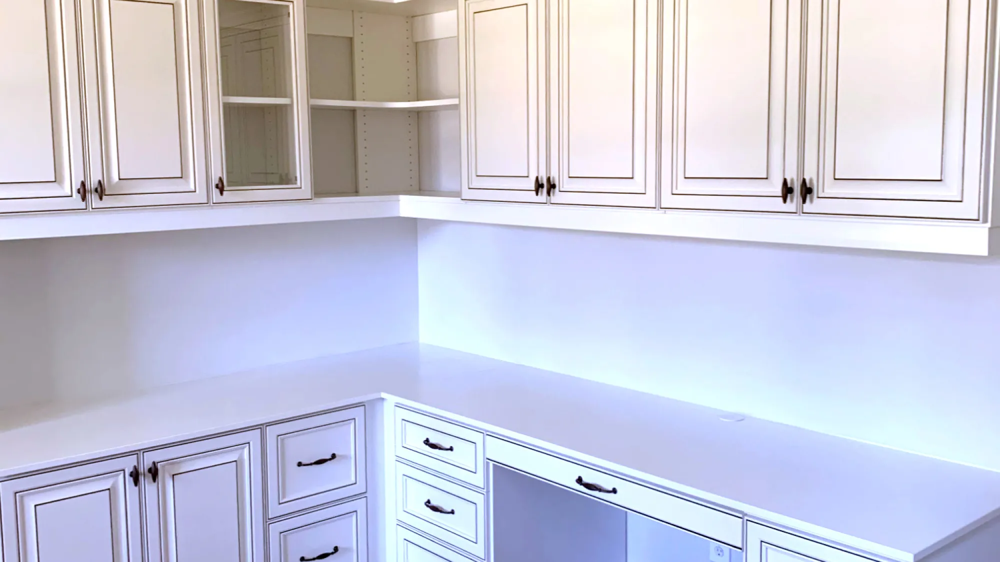 a kitchen with white cabinets