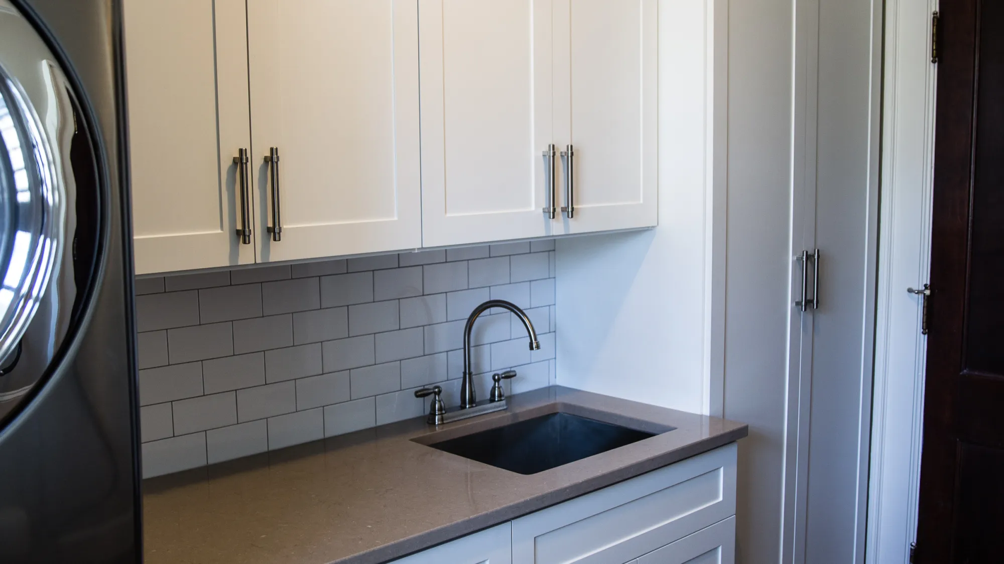 a kitchen with white cabinets