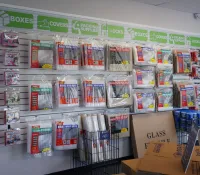 a shelf with boxes and items on it