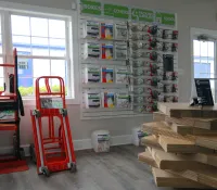 a room with shelves and a computer