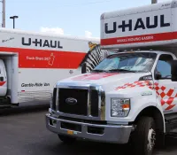 a white truck with a red stripe