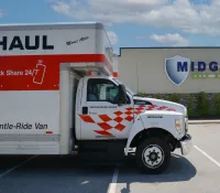 a white truck parked in a parking lot