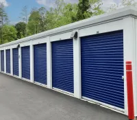 a white building with blue doors