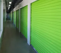 a long hallway with green walls