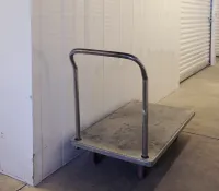 a metal cart on a wooden floor