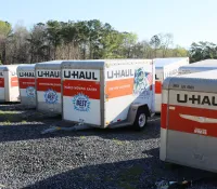 a group of white and orange trailers