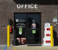 a brick building with a sign on the front