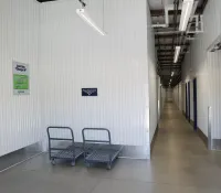 a room with a shopping cart and a fire extinguisher