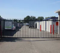 a gated off area with a car parked in the background