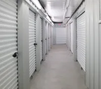 a long hallway with white doors