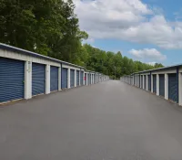 a row of white and blue storage containers