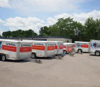 a group of semi trucks parked