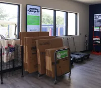 a room with boxes and a cart