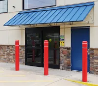 a building with a blue awning