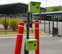 a group of orange and white poles