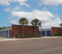 a building with trees and a fence