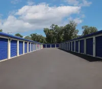 a row of blue and white shipping containers