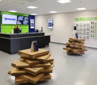 a room with a table and shelves with objects on it