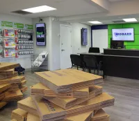 a room with a large group of wooden boxes in it